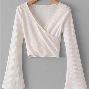 White long sleeved crop top with bell sleeves